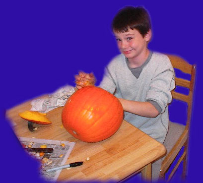 Scottie carves a pumpkin at daddy's